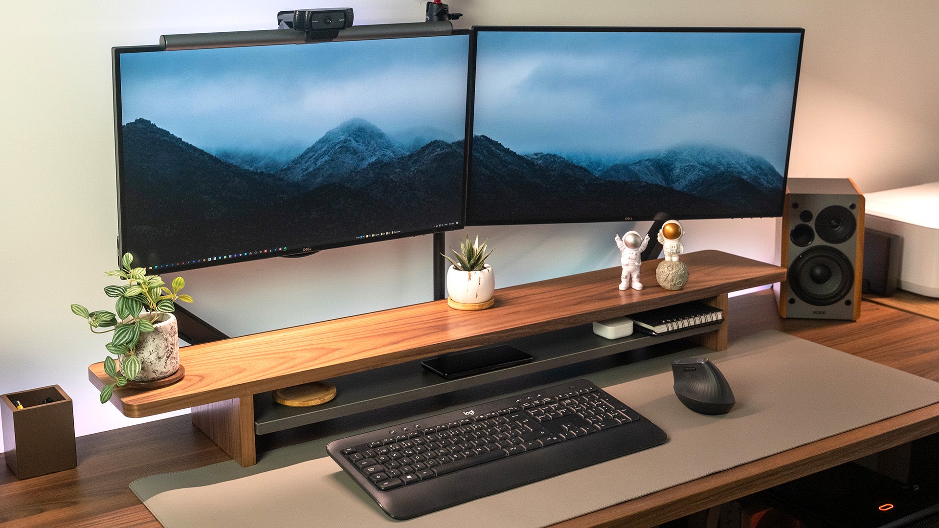 Clean home office with monitor on adjustable arm and tidy cables